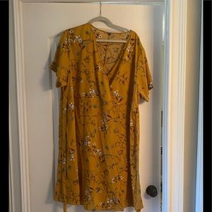 Polyester light weight wrap style dress with belt.